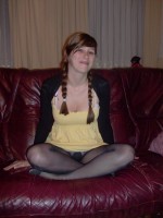 Teen amateur girl in shiny pantyhose pulling up her dress