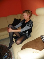 Mature ladies in pantyhose showing off her goodies